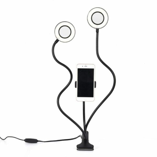 Smartphone with ring light stands for vlogging.